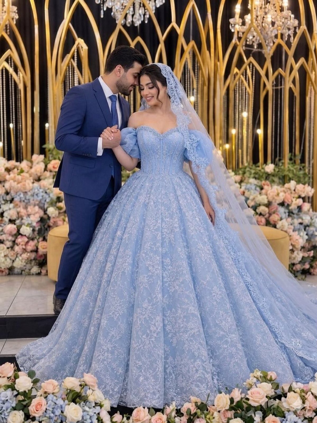 Woman in a light blue lace ball gown and veil posing with a man.