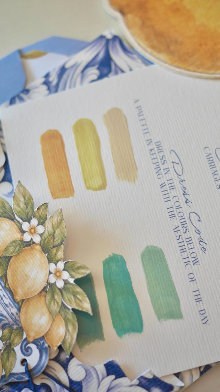 Wedding dress code card featuring yellow and green color palette swatches on fabric.
