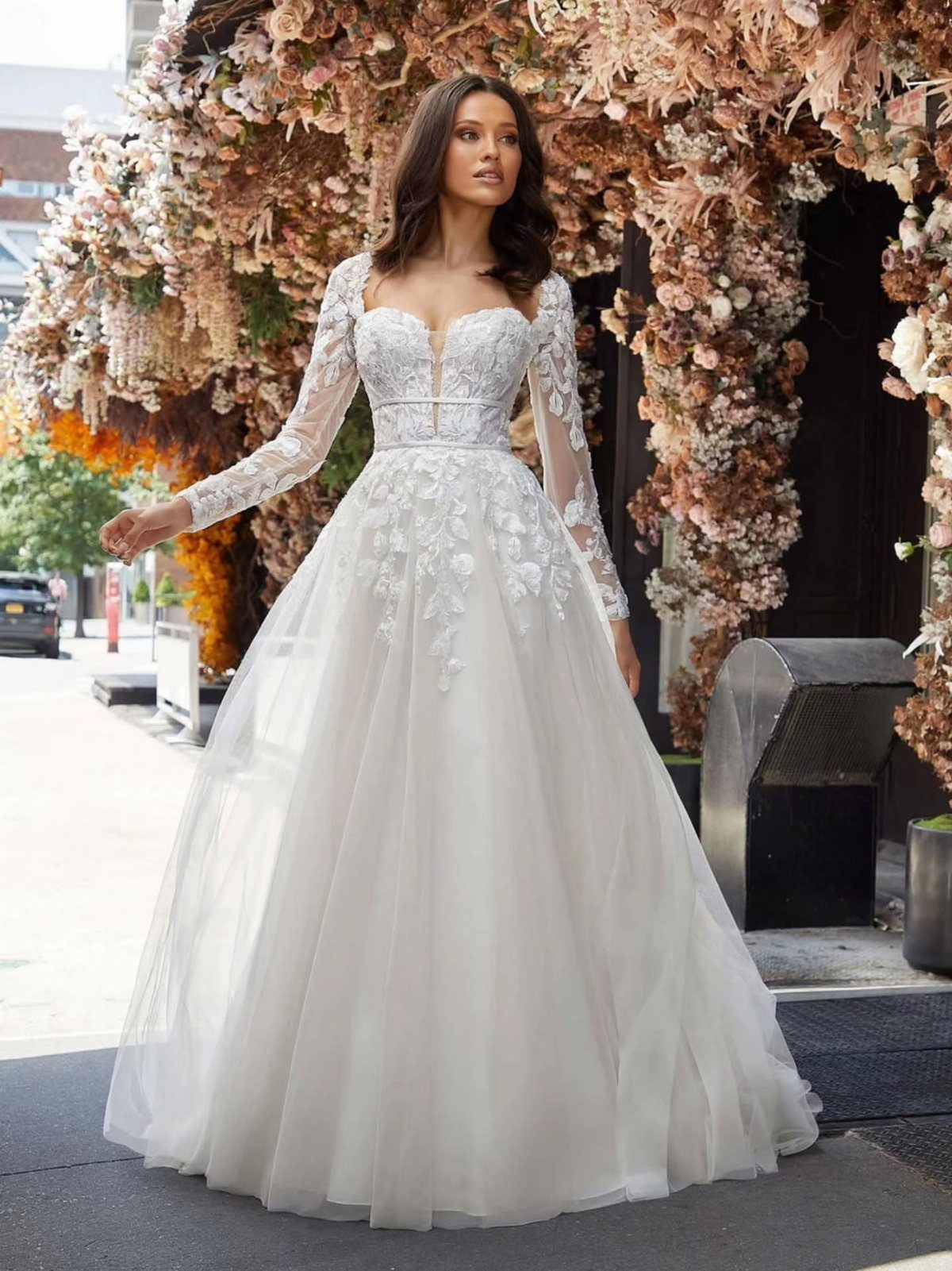 Woman in a white lace wedding dress with a full tulle skirt
