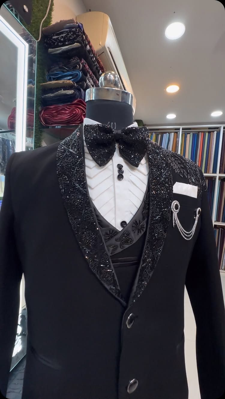 Black tuxedo with shimmering lapels and bow tie on a store mannequin