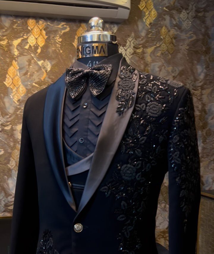 Black tuxedo jacket with floral beadwork and sequins on a mannequin